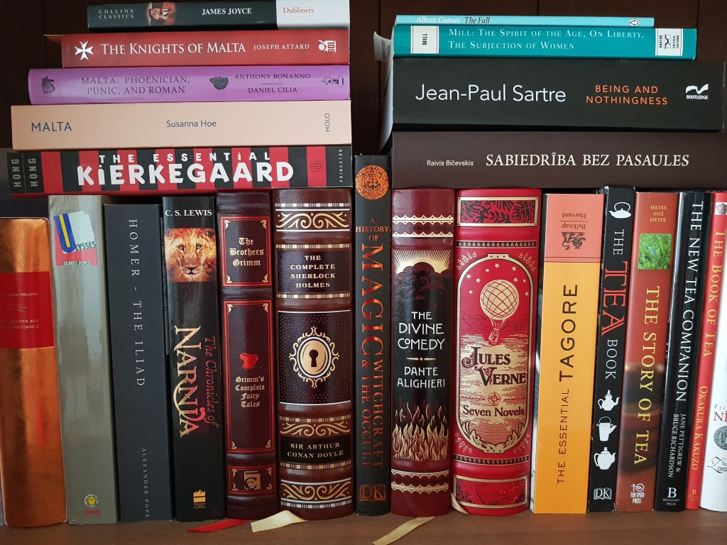 a photo of a bookshelf holding multiple books with colourful spines